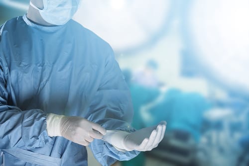 Surgeon Putting on Glove