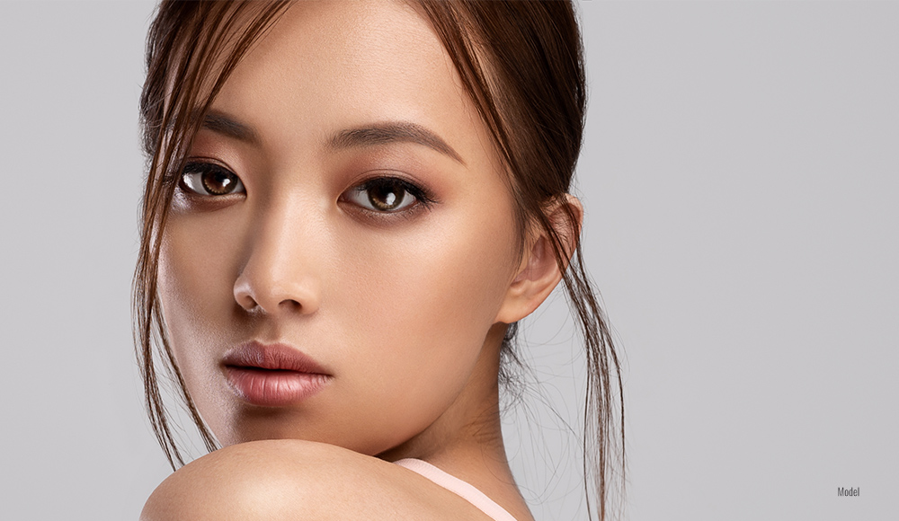 Asian female looking over her shoulder