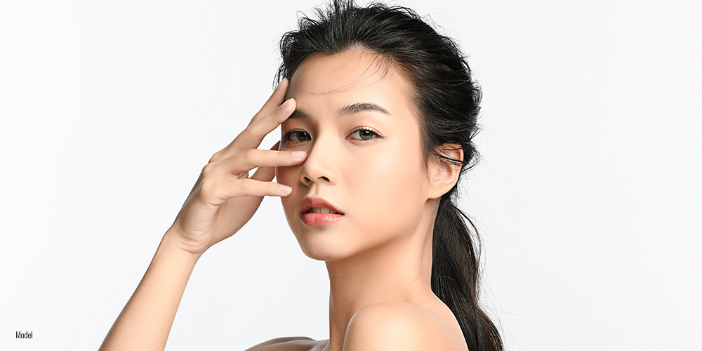 Beautiful Asian female close up face